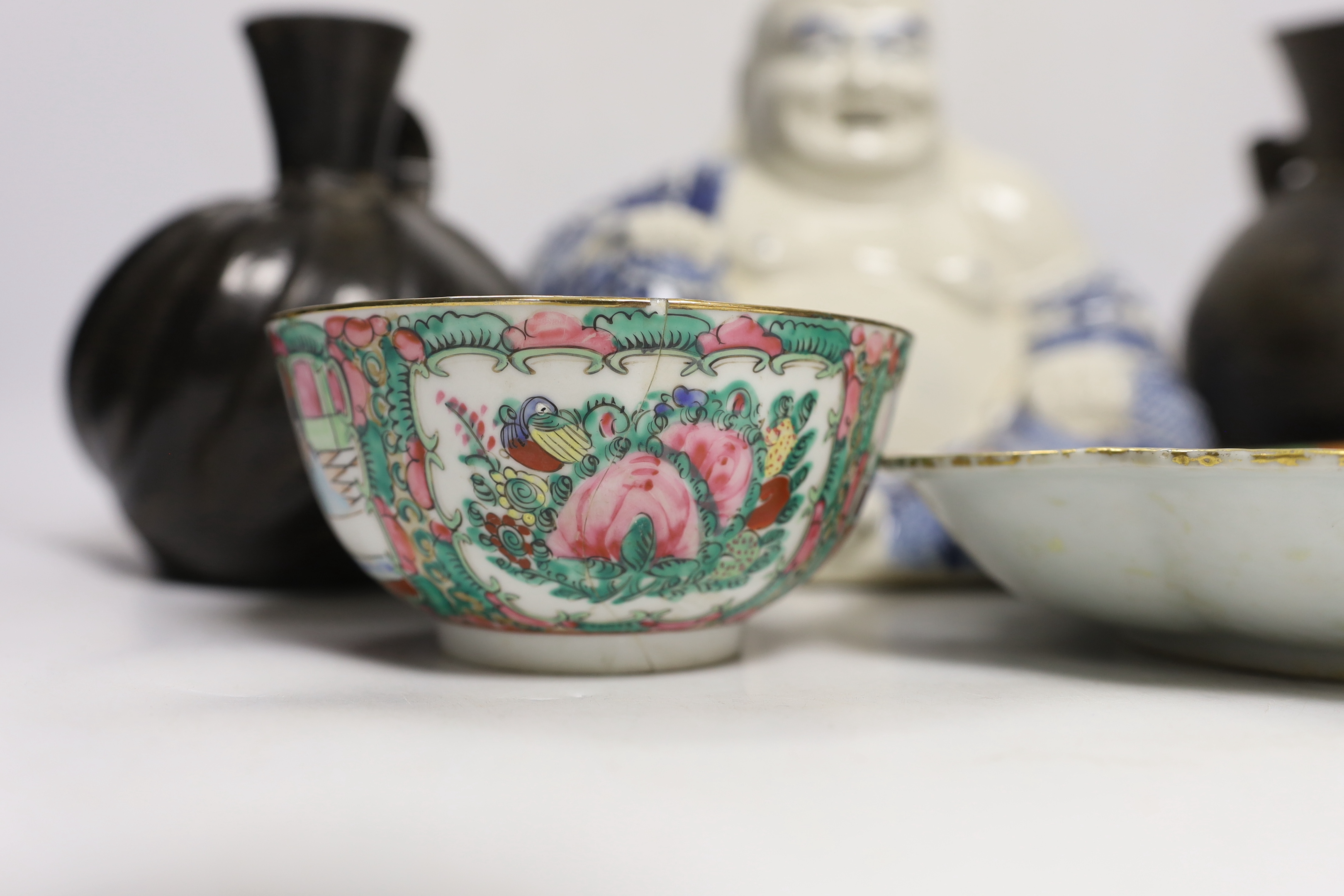 A Chinese blue and white buddha, 21cm, a famille rose dish and bowl and two vessels